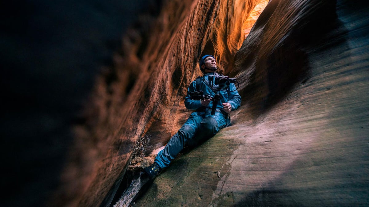 Award-winning filmmaker Danny Schmidt with the Sony FX3 while rappelling in the caves of Utah